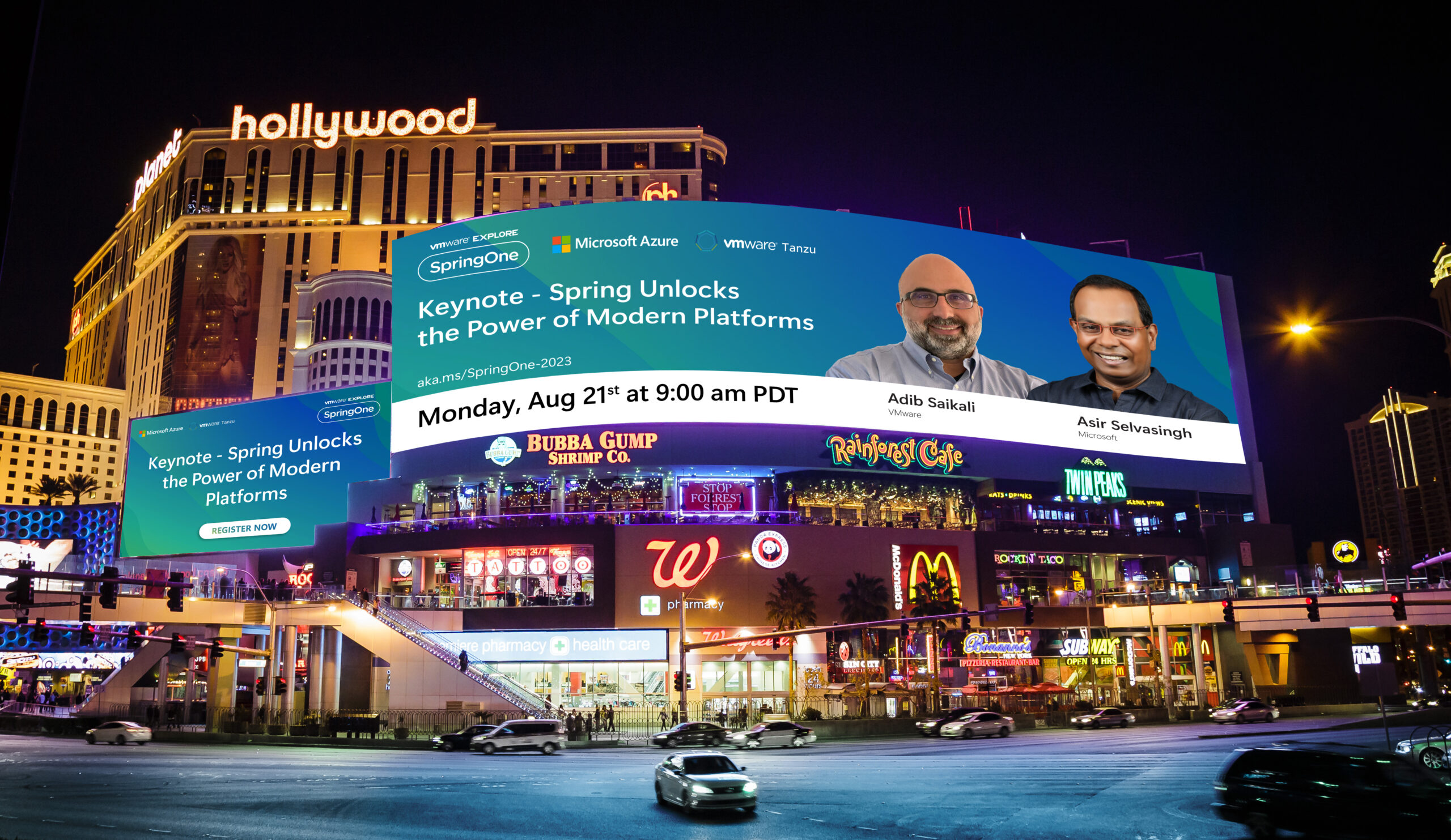 Nighttime Las Vegas strip with a large curved digital billboard advertising SpringOne keynote on a casino hotel backdrop. Typography on the banner reads 'Keynote - Spring Unlocks the Power of Modern Platforms' with two presenters' faces on the right.